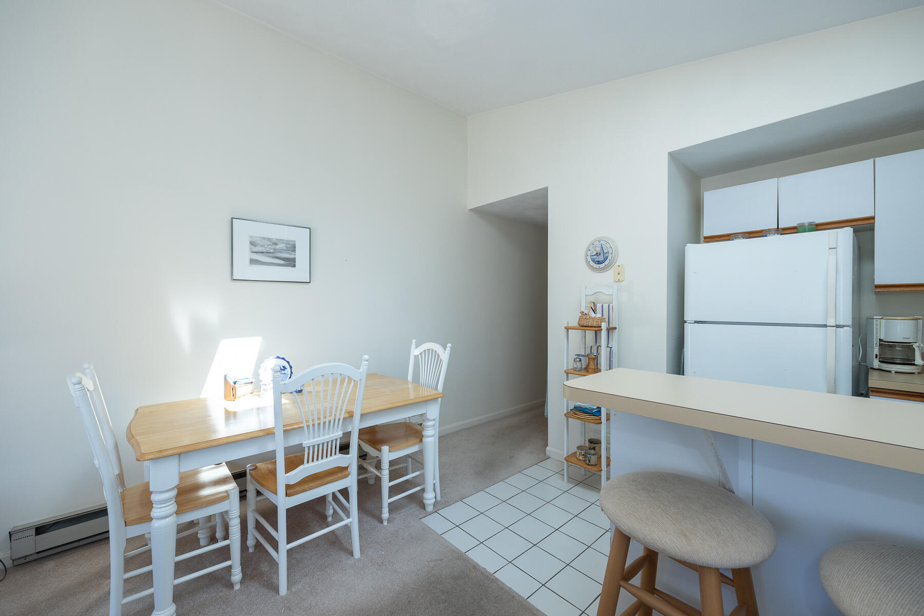 35 Ashumet Road, Unit 7D Mashpee, MA 02649 - Photo 18 of 31 a dining room with furniture and a refrigerator