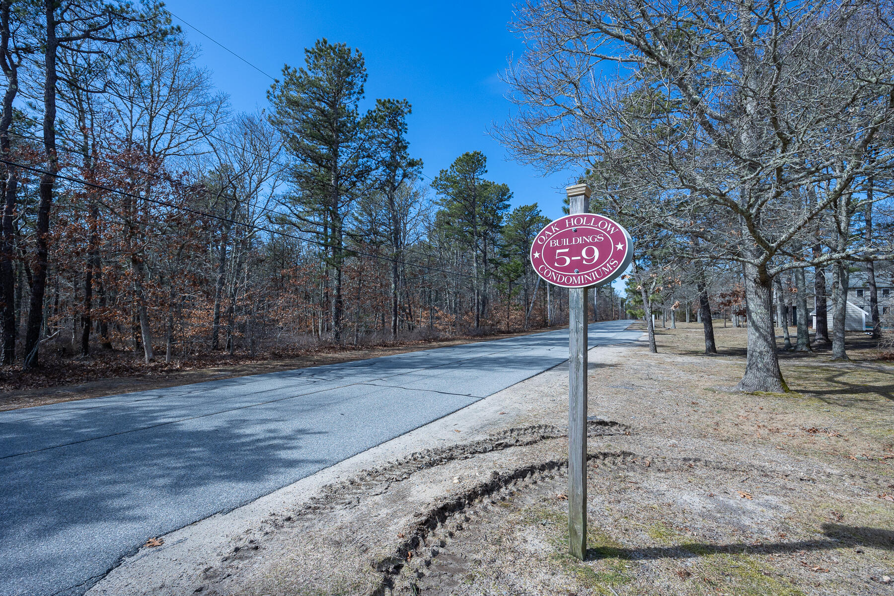 35 Ashumet Road, Unit 7D Mashpee, MA 02649 - Photo 5 of 31 a view of a street with large trees