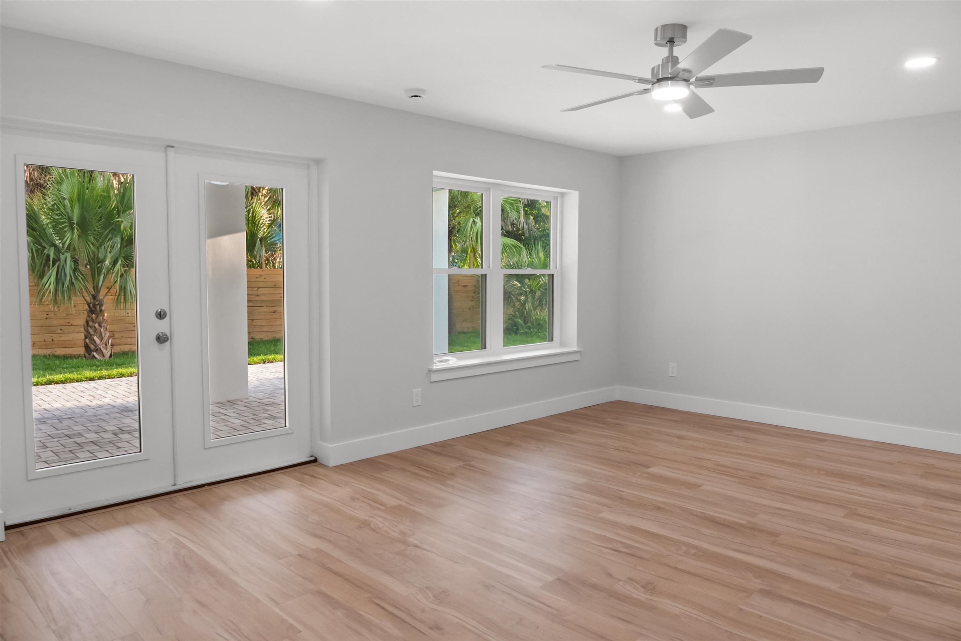 137 Ferrol Road St. Augustine, FL 32084 - Photo 18 of 53 a view of an empty room with a window and wooden floor