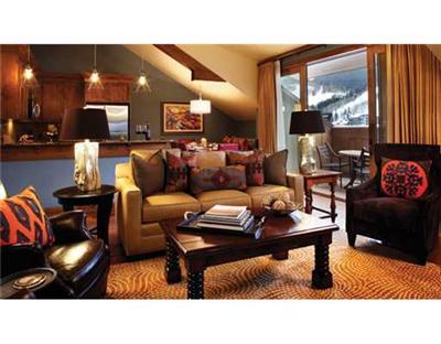 16 Vail Road, Unit 225A Vail, CO 81657 - Photo 3 of 6 a living room with furniture and a floor to ceiling window