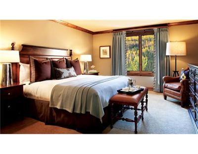 16 Vail Road, Unit 225A Vail, CO 81657 - Photo 4 of 6 a bedroom with a bed and wooden floor