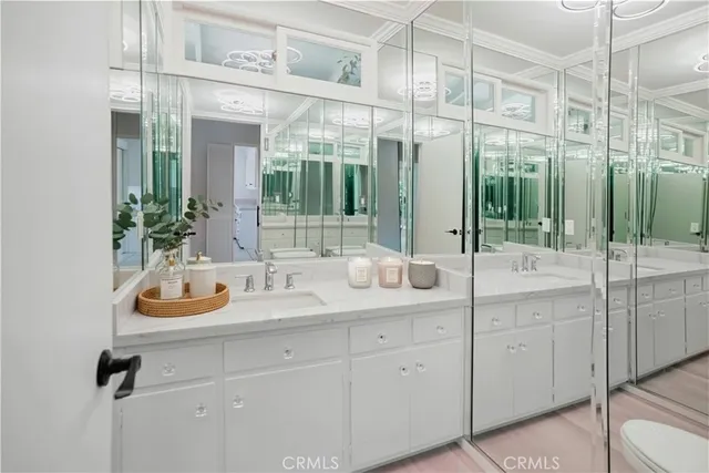 a bedroom with bed and a potted plant