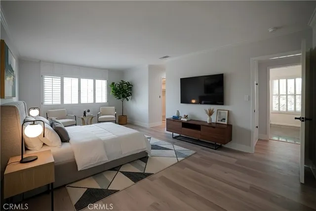 a bedroom with a bed and a couch