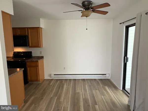 a view of a livingroom with wooden floor