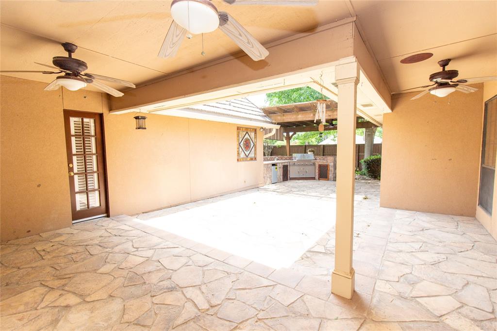3014 Pecan Ridge Drive Rowlett, TX 75088 - Photo 26 of 29 a view of a porch with a table and chairs