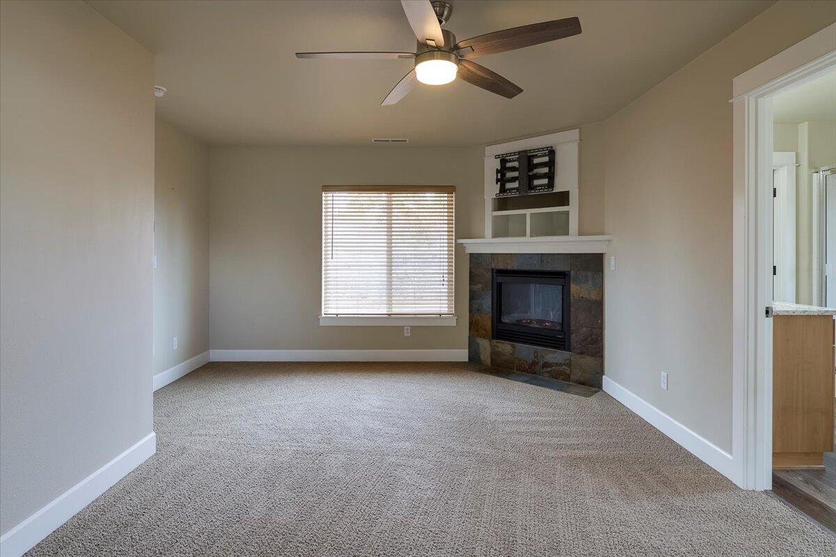 20370 Murphy Road Bend, OR 97702 - Photo 14 of 33 Primary Suite with gas fireplace and conveniently located off of the upstairs family room