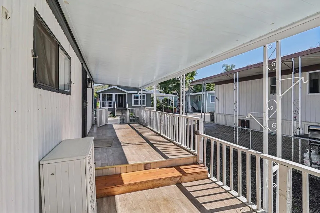 10767 Jamacha Spring Valley, Unit 217 Spring Valley, CA 91978 - Photo 19 of 24 a view of balcony with wooden floor and fence