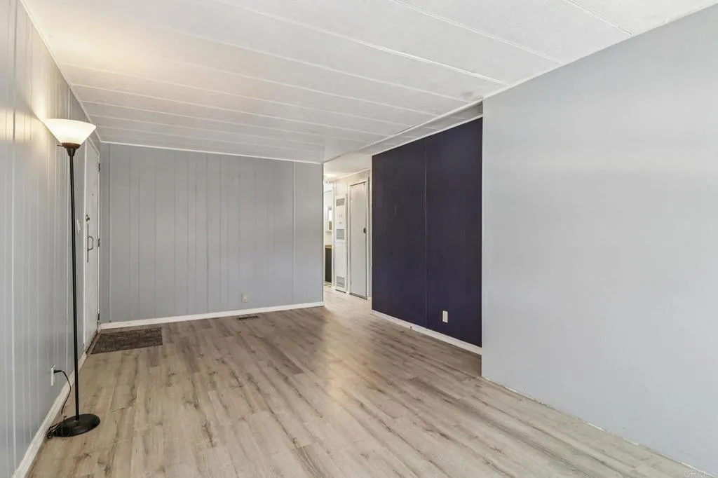 10767 Jamacha Spring Valley, Unit 217 Spring Valley, CA 91978 - Photo 5 of 24 a view of an empty room with wooden floor