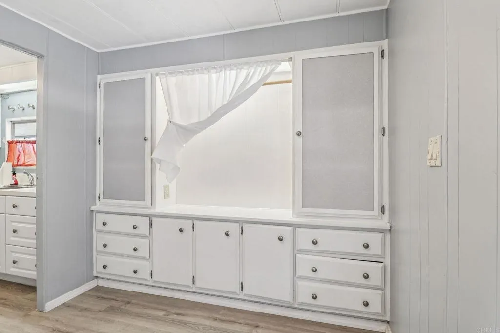 10767 Jamacha Spring Valley, Unit 217 Spring Valley, CA 91978 - Photo 10 of 24 wooden floor with white walls