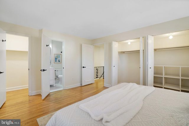 a bedroom with a bed and a bathroom