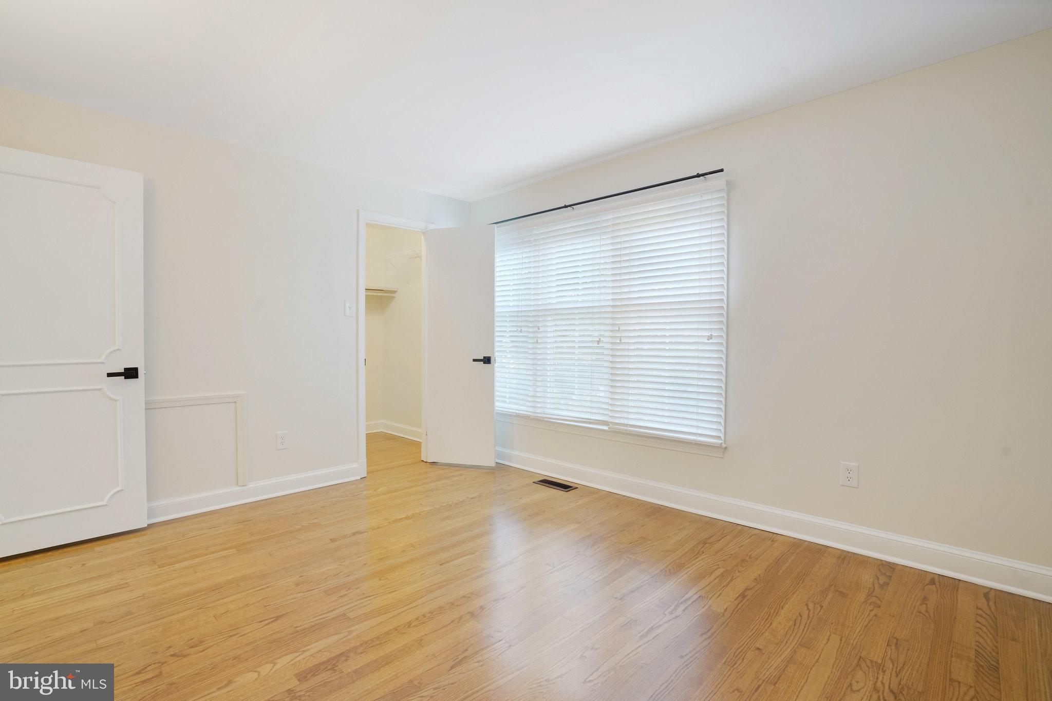 3135 14th Street South Arlington, VA 22204 - Photo 32 of 53 a view of an empty room with wooden floor and a window