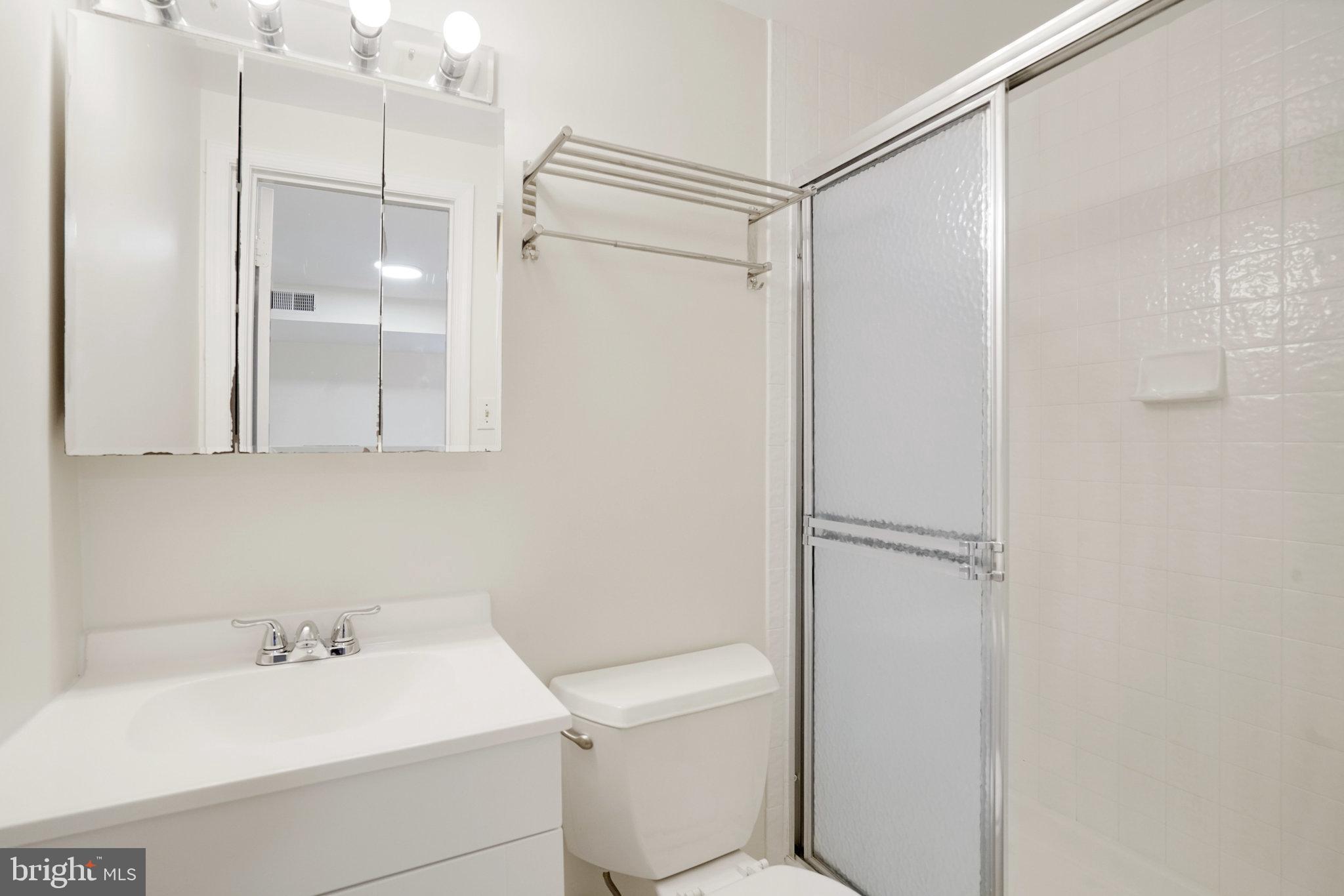 3135 14th Street South Arlington, VA 22204 - Photo 42 of 53 a bathroom with a sink toilet and shower