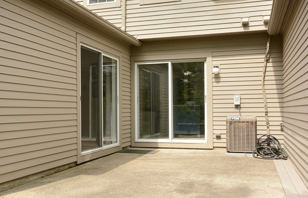 307 Ridgefield Circle, Unit C Clinton, MA 01510 - Photo 18 of 18 a view of a door and a window