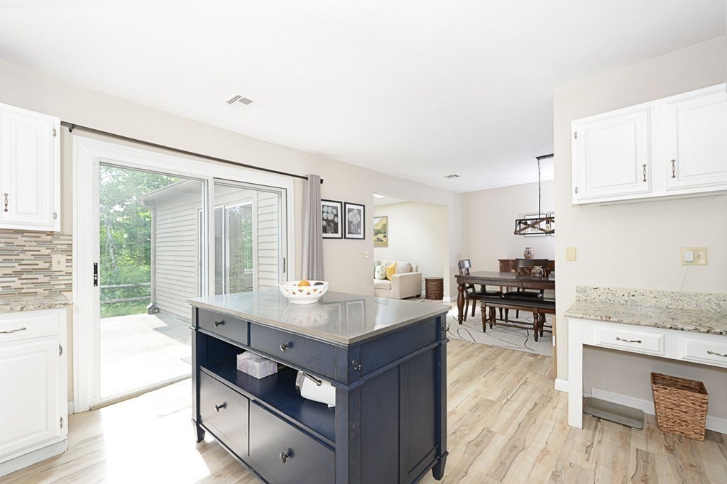 307 Ridgefield Circle, Unit C Clinton, MA 01510 - Photo 5 of 18 a living room with granite countertop furniture and a table