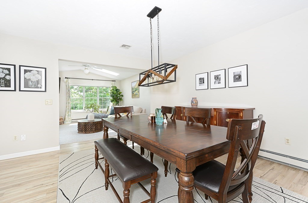 307 Ridgefield Circle, Unit C Clinton, MA 01510 - Photo 8 of 18 a view of a dining room with furniture window and wooden floor