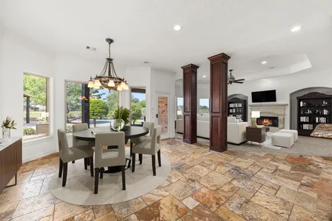 a view of a dining room with furniture window and outside view