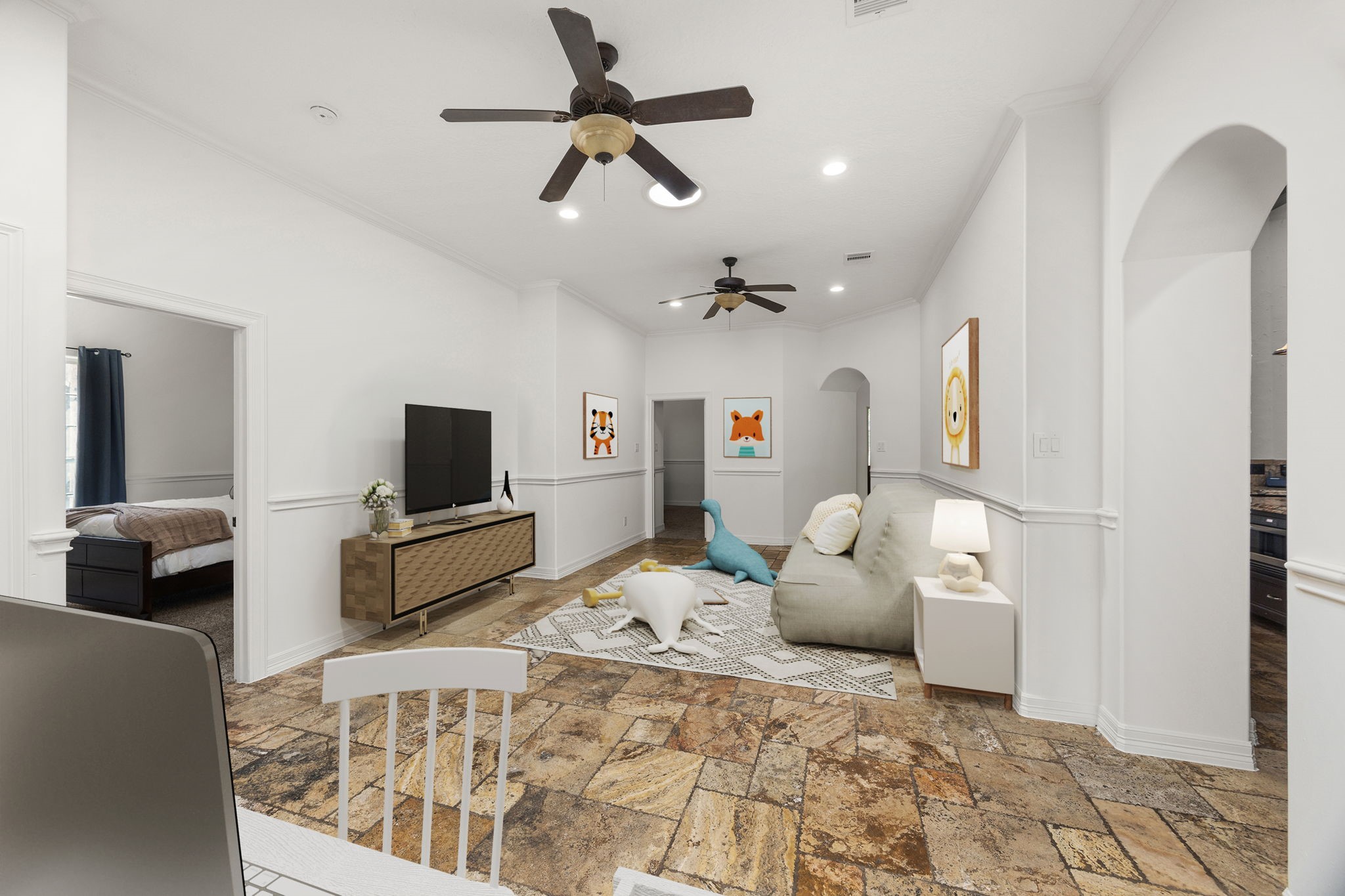 4611 Oasis Point Katy, TX 77493 - Photo 22 of 41 From this perspective you can see entrances to two of the secondary bedrooms on the left and pathways to the central area of the home on the right through either of the archways. The home's central vacuum system reaches all corners of the home for ease of maintenance.