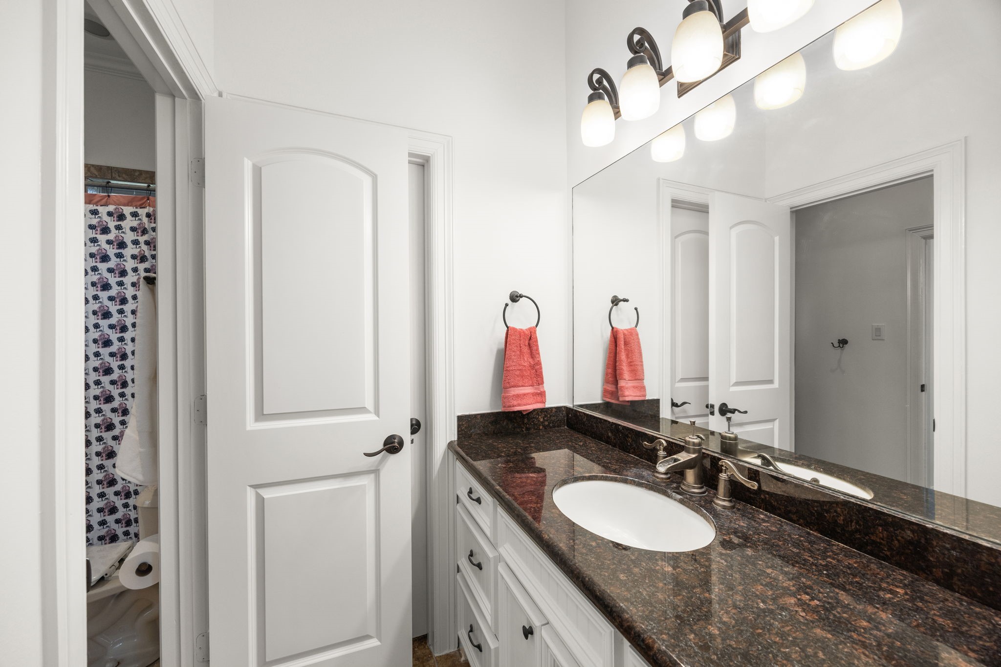 4611 Oasis Point Katy, TX 77493 - Photo 24 of 41 The secondary bedrooms each have their own sink and closet area with ample storage space. This allows occupants of the secondary bedrooms the opportunity for privacy when preparing for the day. The Jack-and-Jill or Hollywood style baths have a shared tub/toilet space.