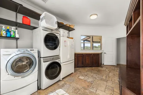 a view of a hallway with washer and dryer