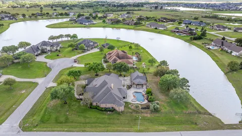an aerial view of a house with a lake view