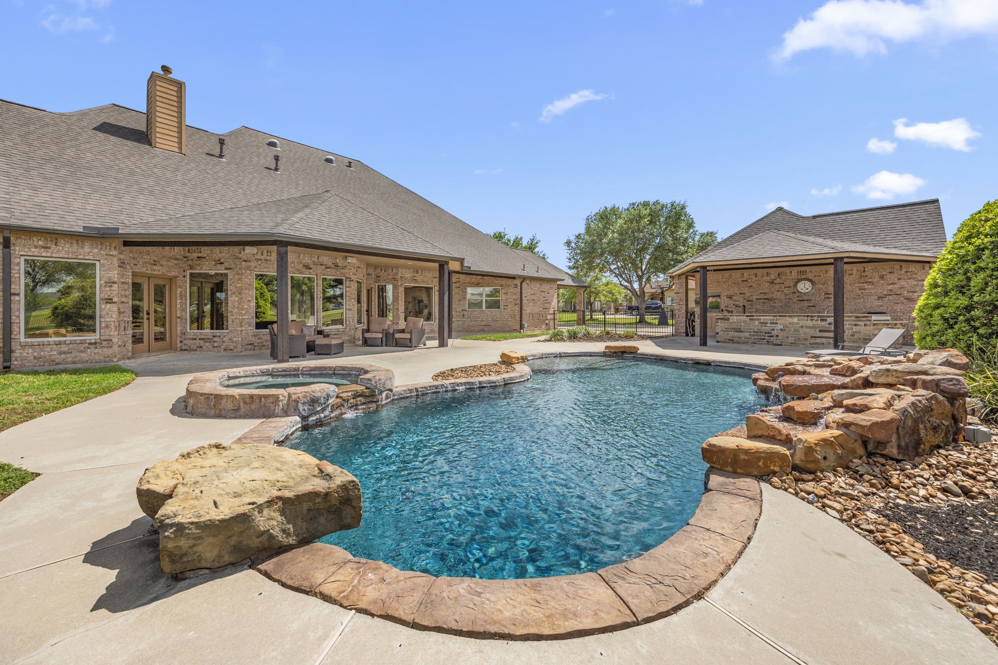 4611 Oasis Point Katy, TX 77493 - Photo 32 of 41 The pebbletech pool surface is both functional and attractive. The heated pool can be enjoyed year round, or you can relax in the spa. The pool heater and pump were replaced in preparation for listing, eliminating another "to do" item from your list. The rock waterfall is not inly gorgeous, the sound of the water is especially soothing.