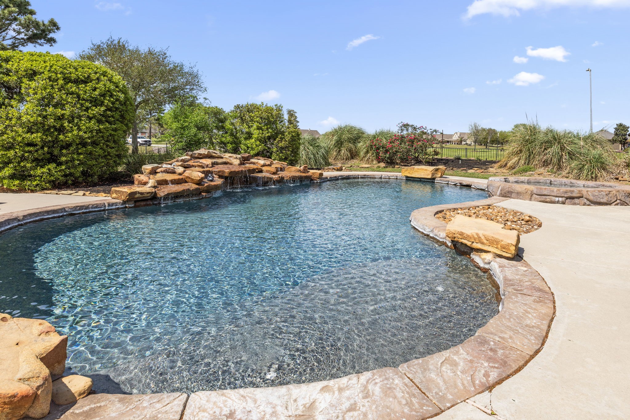 4611 Oasis Point Katy, TX 77493 - Photo 35 of 41 Not sure if you want to go for a full swim? You can hang out on the sunshelf and get some sun while staying cool.