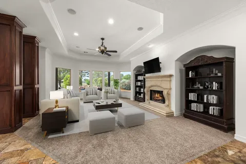 a living room with furniture and a fireplace