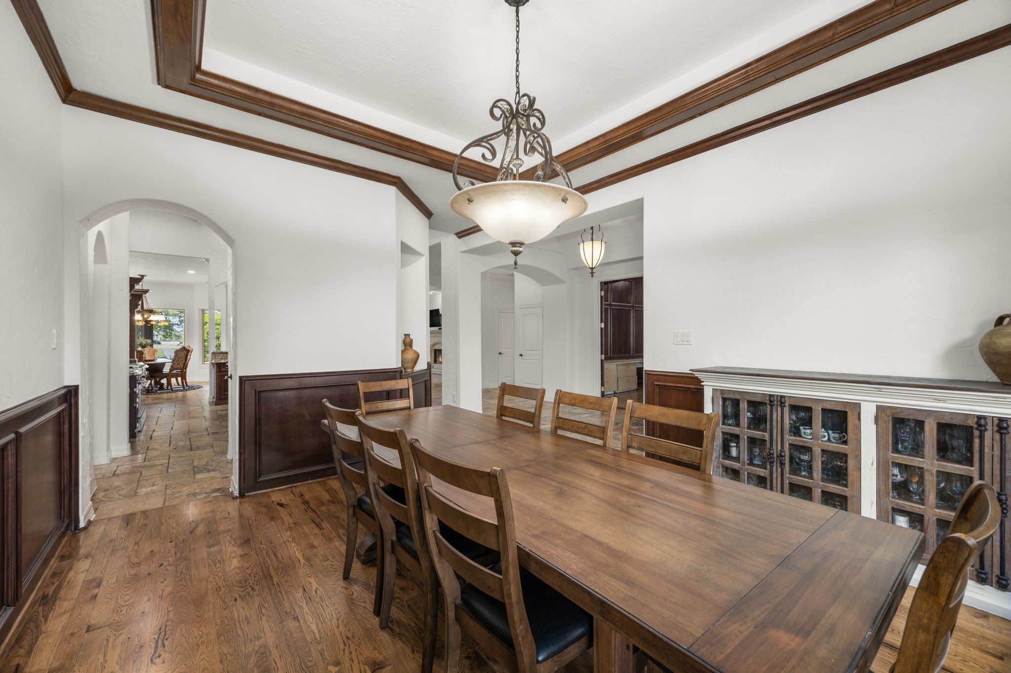 4611 Oasis Point Katy, TX 77493 - Photo 7 of 41 The dining room is conveniently located with direct access to the kitchen for ease of serving. The view of this room from the entryway is at once inviting and impressive, with nods to the millwork you will see throughout the home.