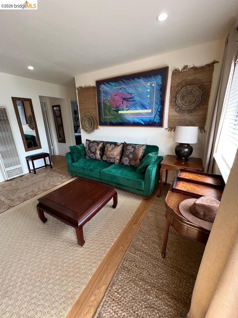 1728 Seventh Street, Unit F Berkeley, CA 94710 - Photo 3 of 6 living room with wood finished floors, a heating unit, and recessed lighting