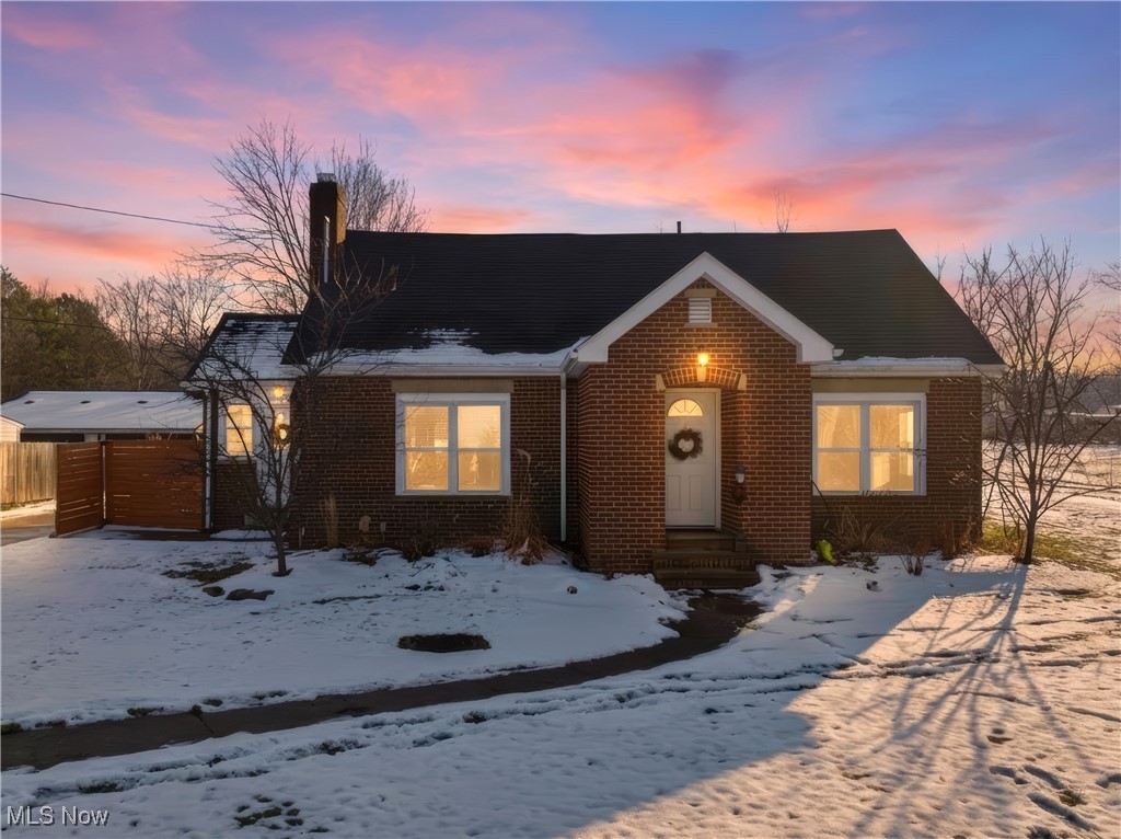 34549 Detroit Road Avon, OH 44011 - Photo 1 of 50 View of front of home with brick siding and a chimney