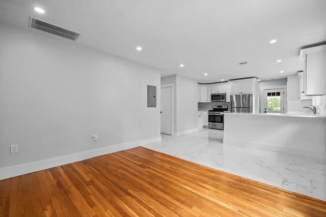 a view of kitchen with wooden floor