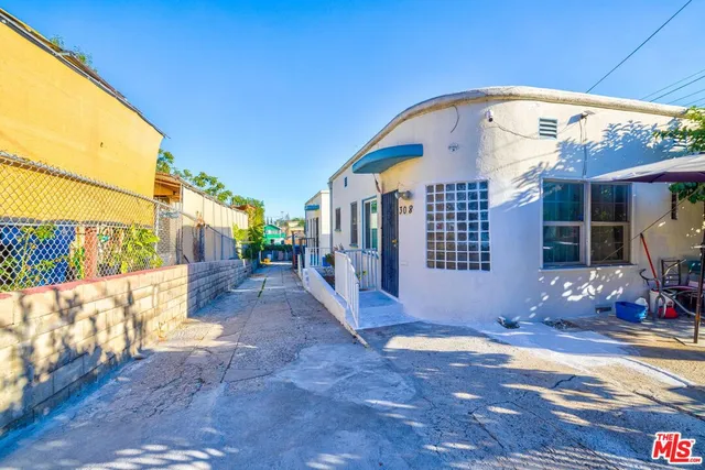 a view of a house with a iron fence
