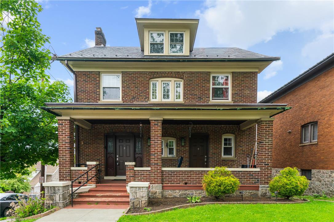 2055 Ferry Street Wilson, PA 18042 - Photo 1 of 21 This brick facade home boasts a charming front porch, ideal for welcoming guests.