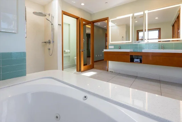 a bathroom with a bathtub and a sink