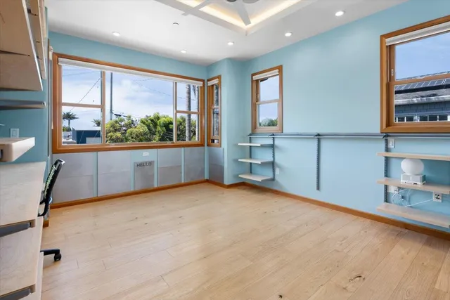 a view of workspace with window and cabinet