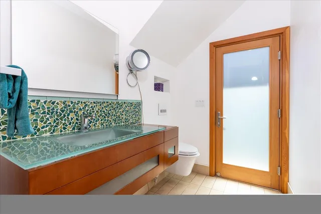 a view of a living room and bathroom