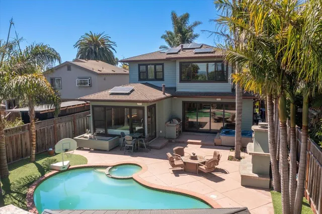 a building outdoor space with patio furniture and potted plants