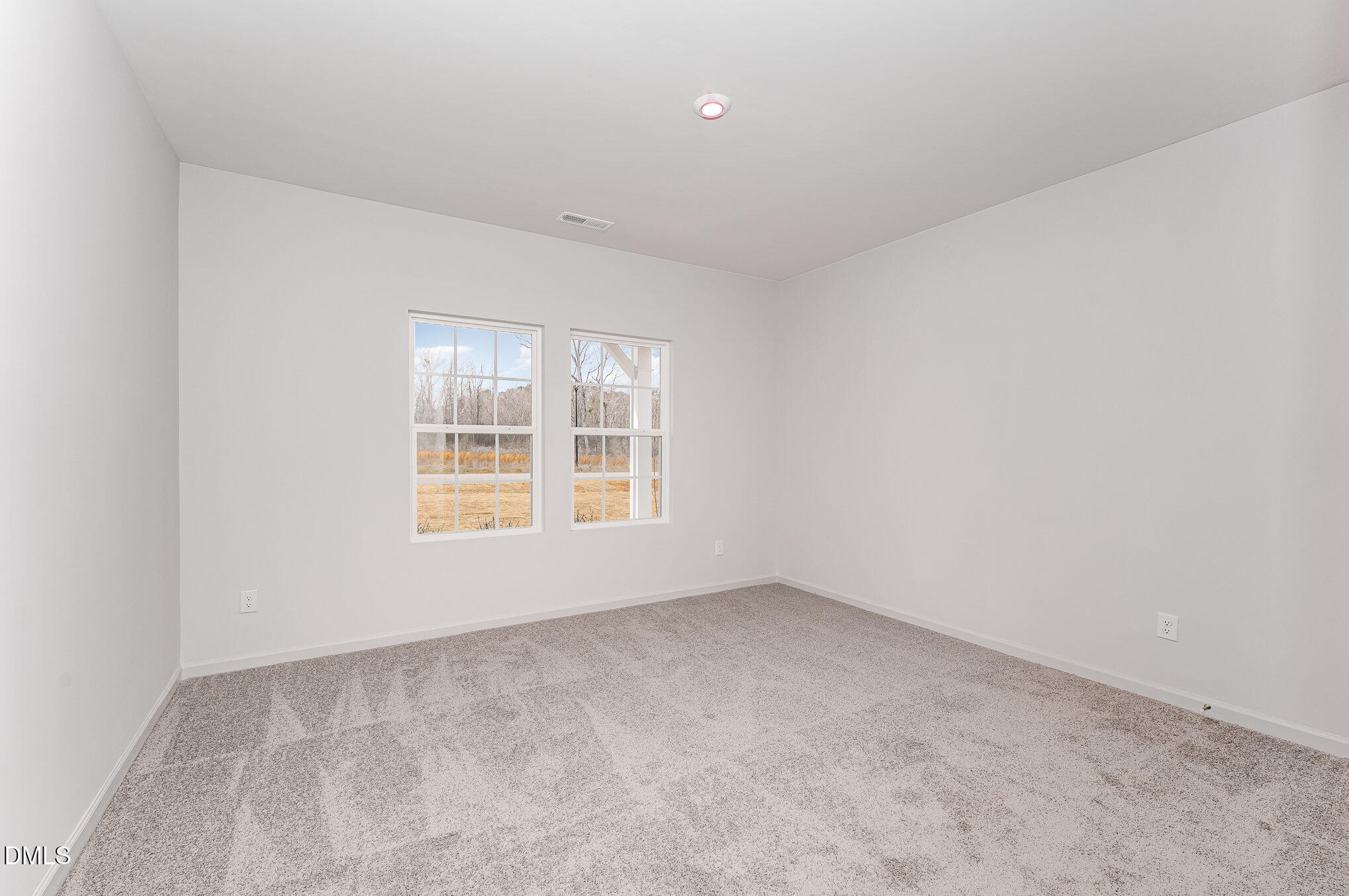 146 Starlet Ridge Way Clayton, NC 27520 - Photo 10 of 18 an empty room with a window