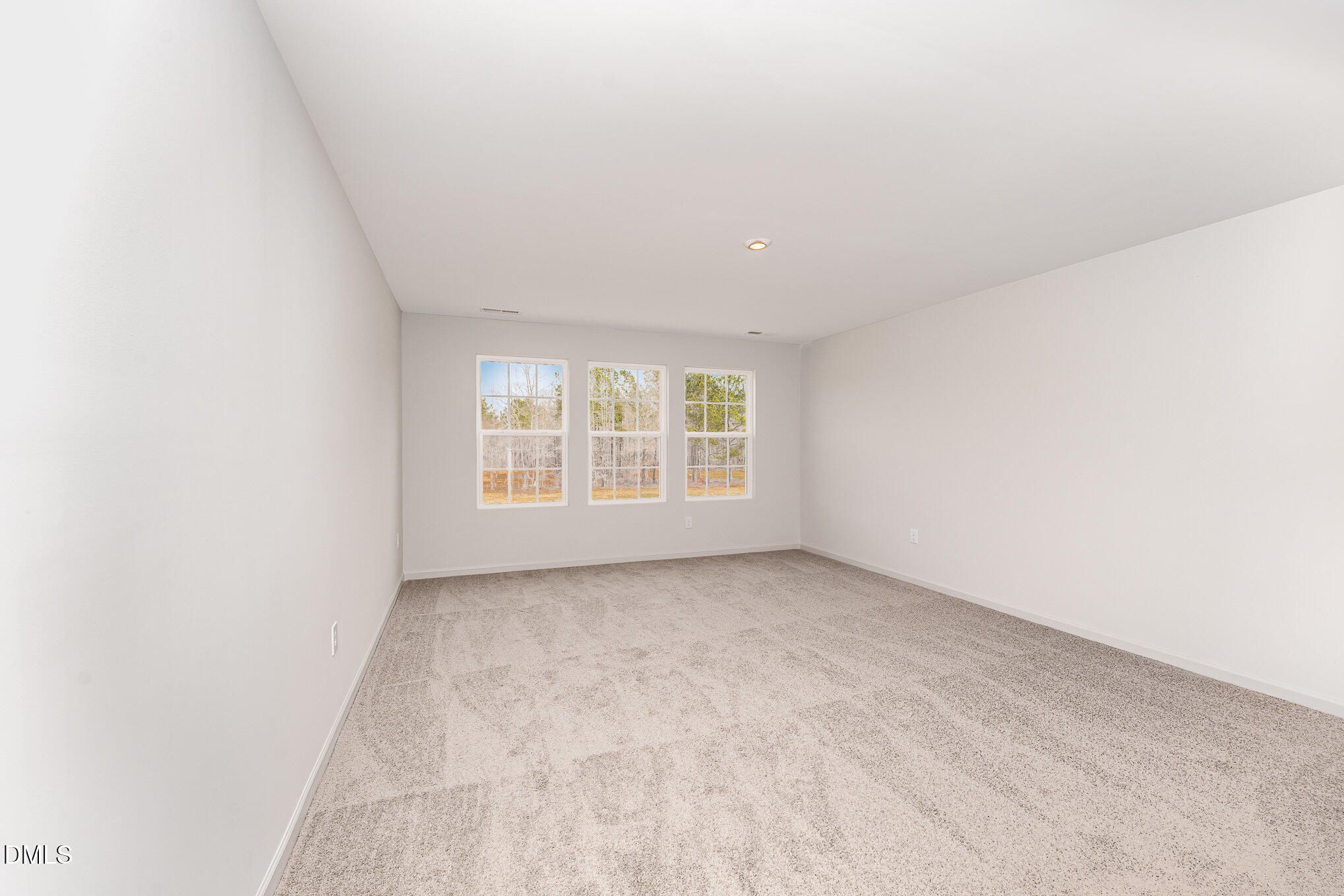 146 Starlet Ridge Way Clayton, NC 27520 - Photo 12 of 18 an empty room with windows