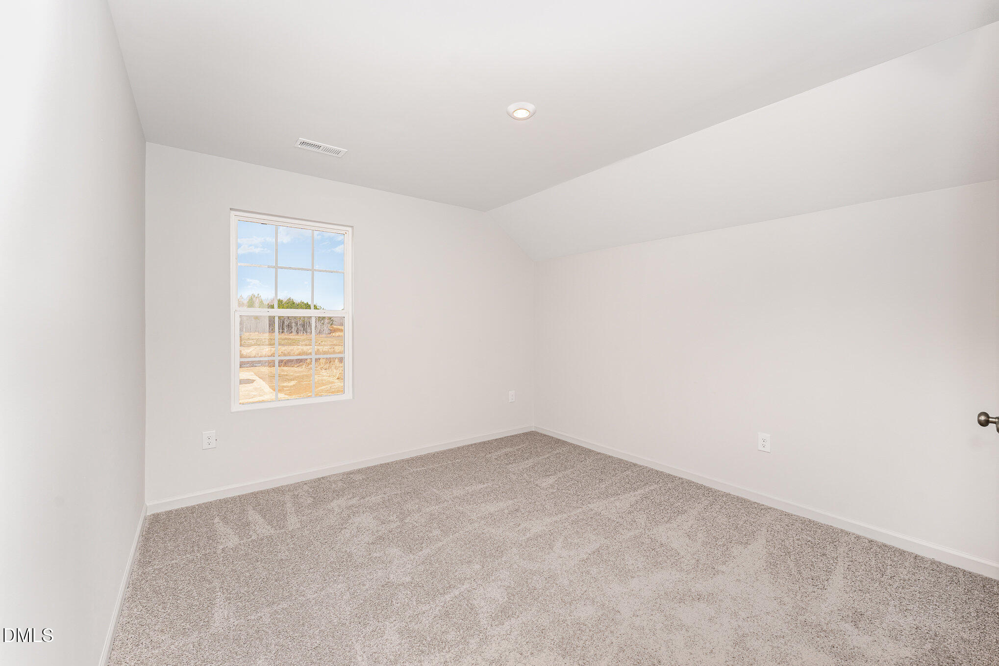 146 Starlet Ridge Way Clayton, NC 27520 - Photo 14 of 18 an empty room with a window