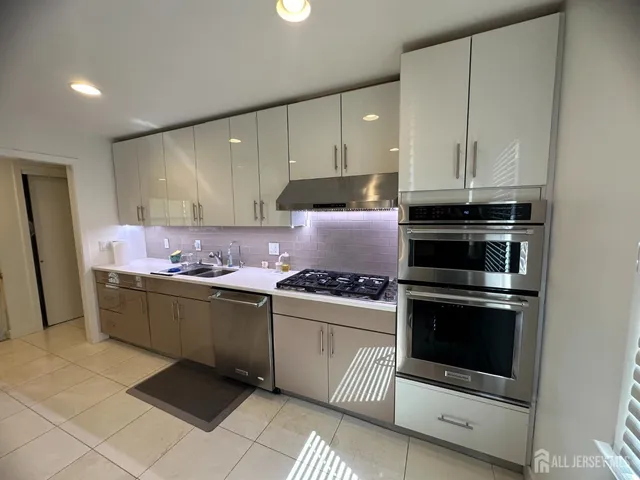 a view of a hallway with seating area