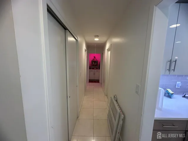 a bedroom with a bed and a wooden floor