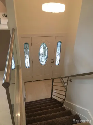 an empty room with wooden floor and closet