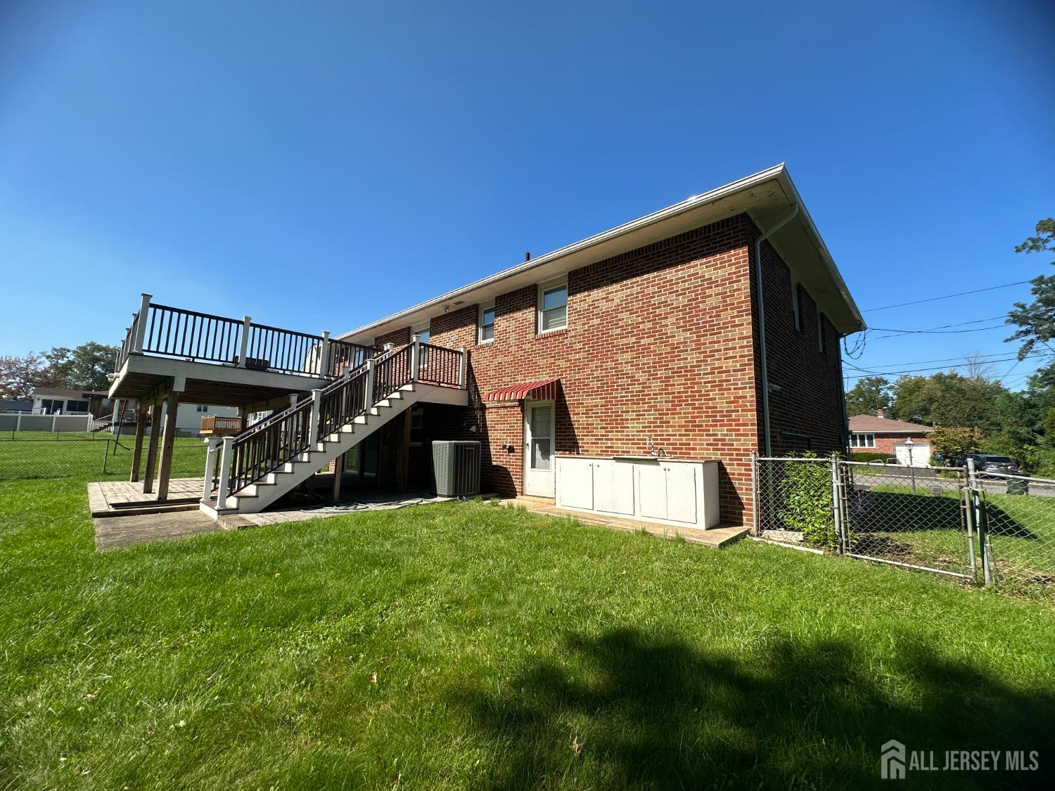 9 Holly Road Iselin, NJ 08830 - Photo 4 of 31 a view of a house with a yard
