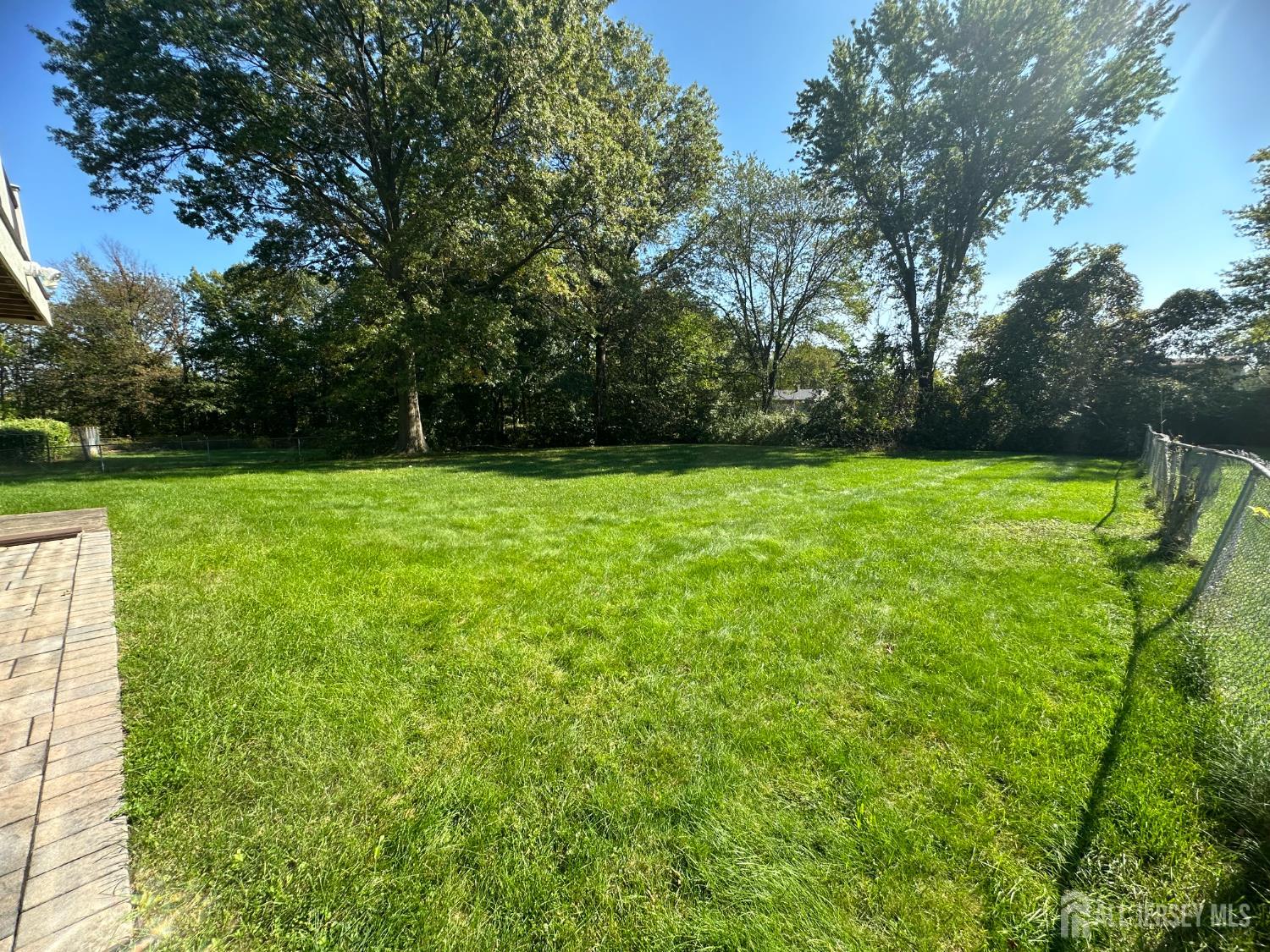 9 Holly Road Iselin, NJ 08830 - Photo 6 of 31 a view of field with trees in the background