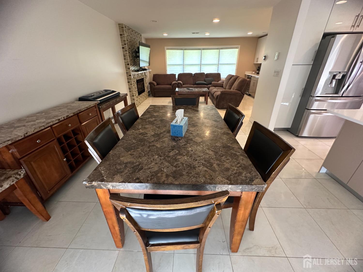9 Holly Road Iselin, NJ 08830 - Photo 10 of 31 a kitchen with table and chairs