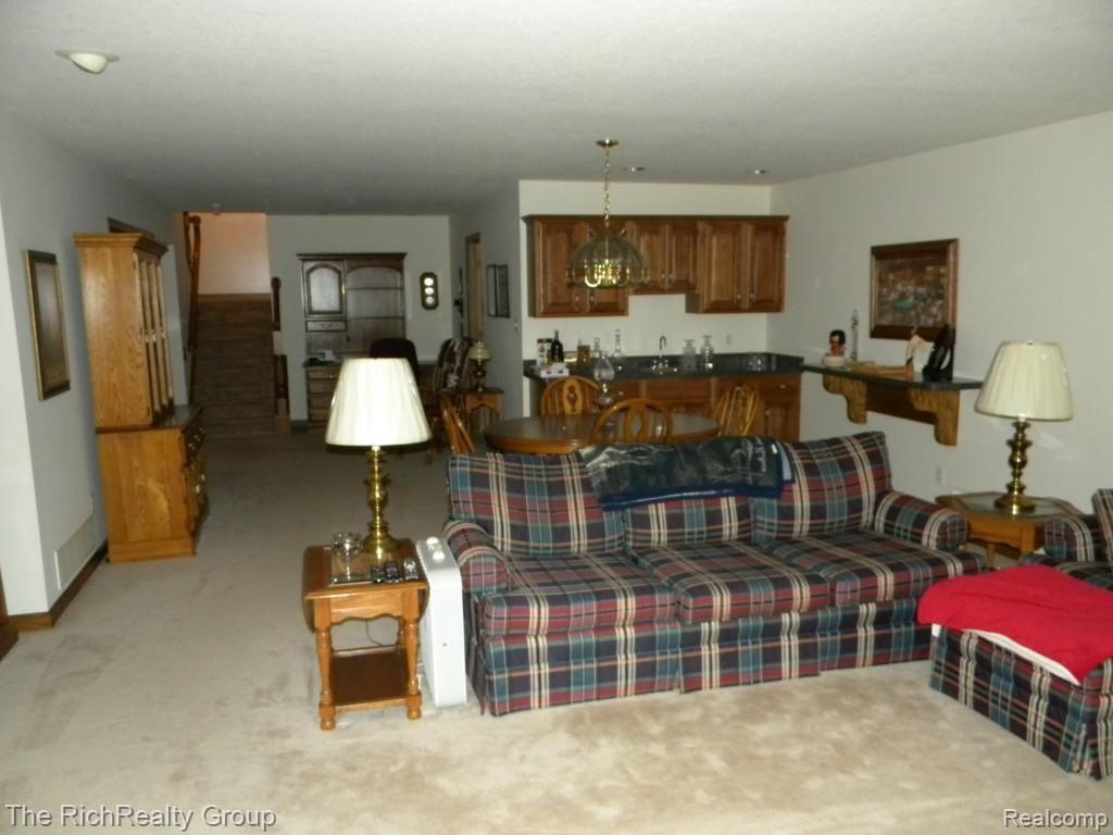 3116 Rivers Edge Drive Wayne, MI 48184 - Photo 25 of 33 Basement with Wet bar and family room.
