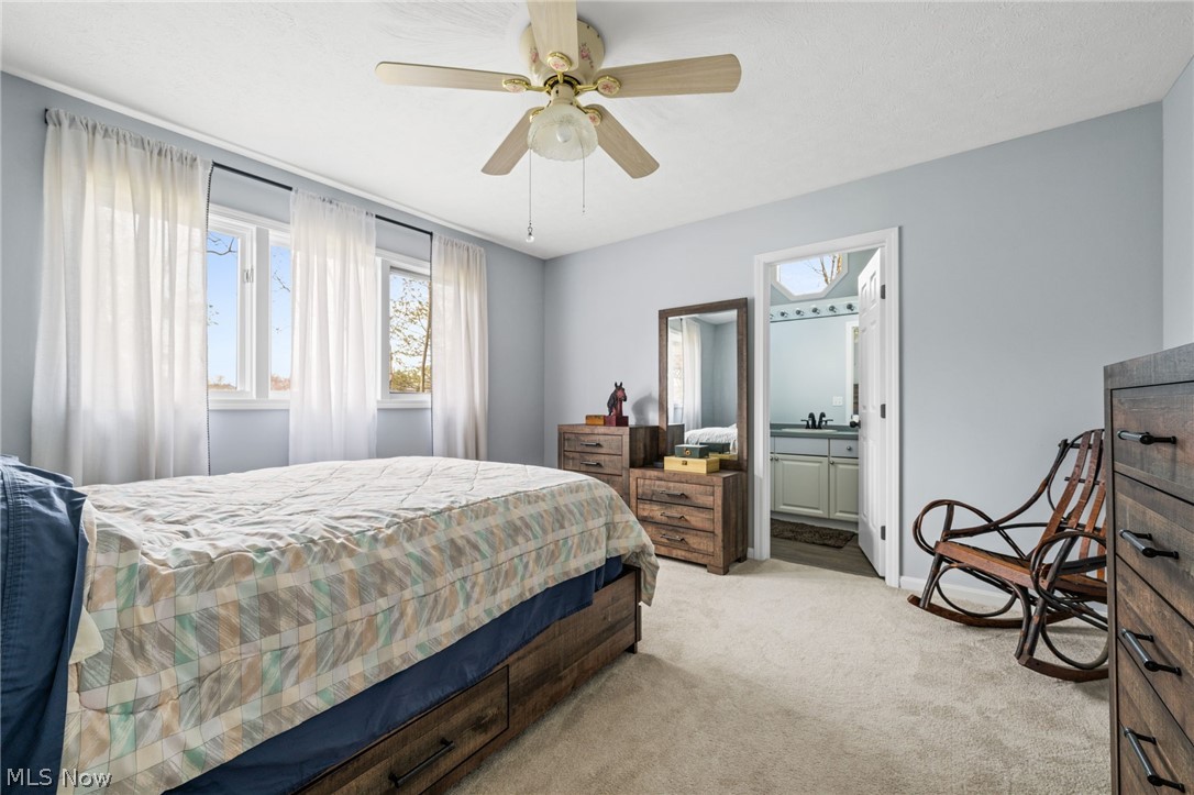5352 Jaycox Road North Ridgeville, OH 44039 - Photo 20 of 27 Carpeted bedroom with ensuite bath and ceiling fan