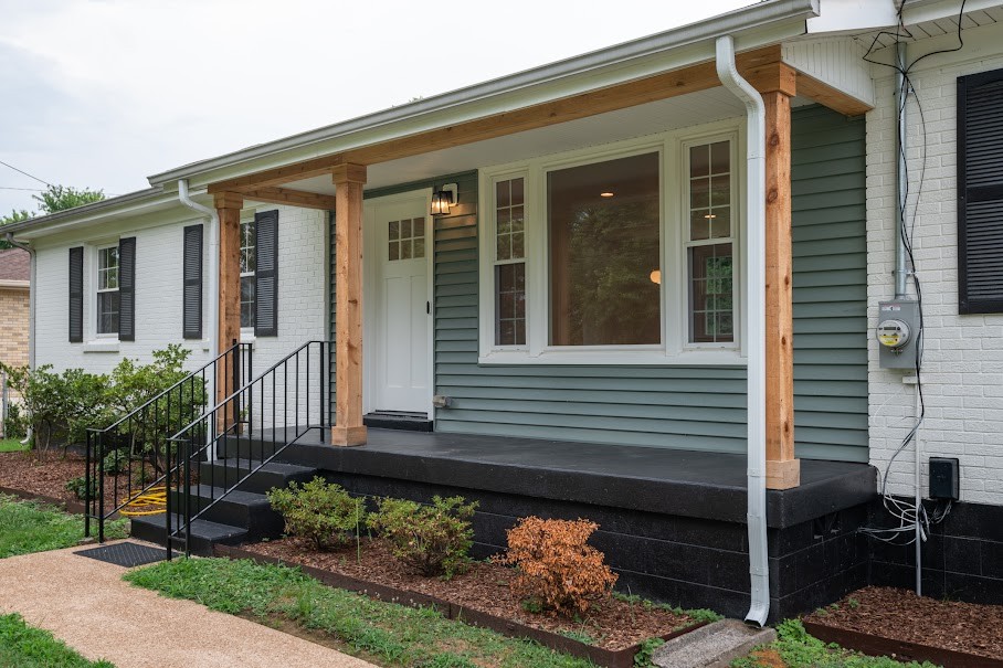 a front view of a house with garden