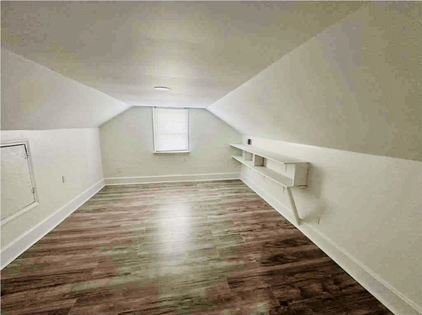 3442 Carrington Road Memphis, TN 38111 - Photo 11 of 25 Bonus room with lofted ceiling, baseboards, and wood finished floors